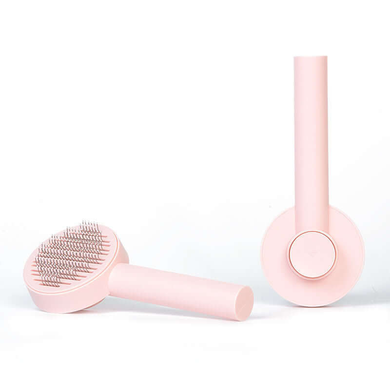 small pink pet hair comb